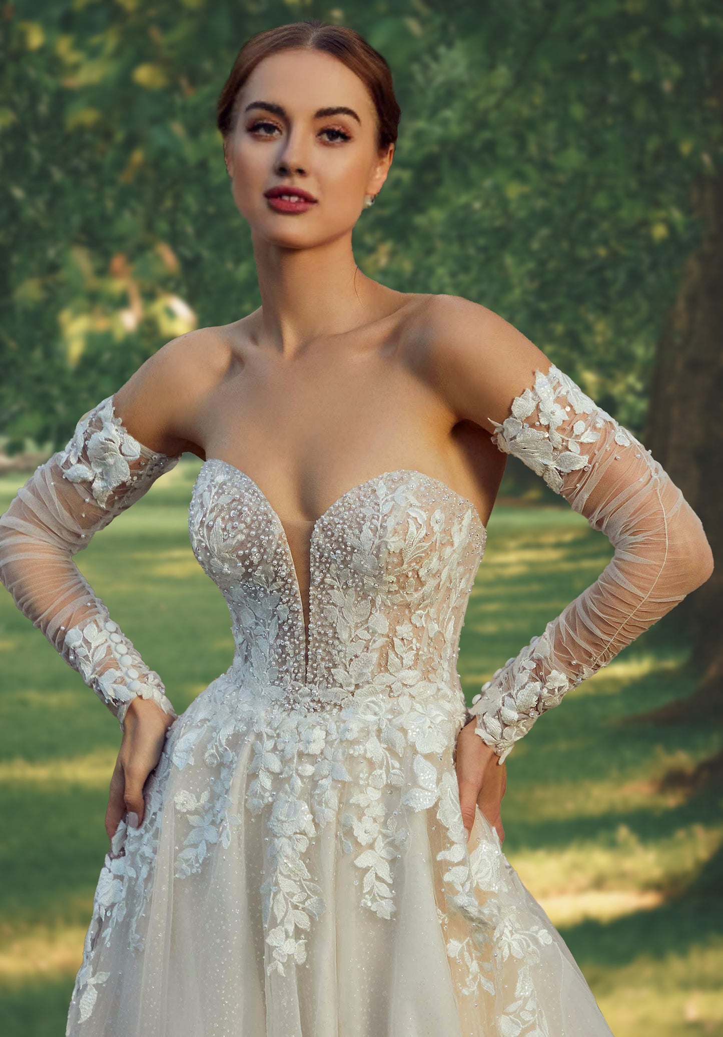 Breathtaking A-line has a plunging sweetheart bodice with pearl and crystal beading and floral embroidered appliqués.